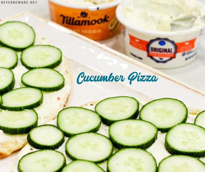 Cucumber pizza is a simple no-bake appetizer made with naan bread, cream cheese, Italian seasoning, and cucumbers cut into cucumber bites.