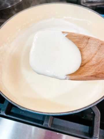 This easy Alfredo sauce with cream cheese recipe made with five ingredients in under 10 minutes is the base for many fast weeknight meals.