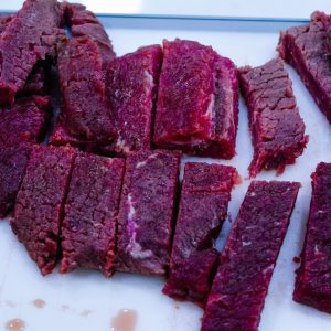 Start by slicing the cube steak and cutting the pieces in half. Put the steak fingers in a bowl.