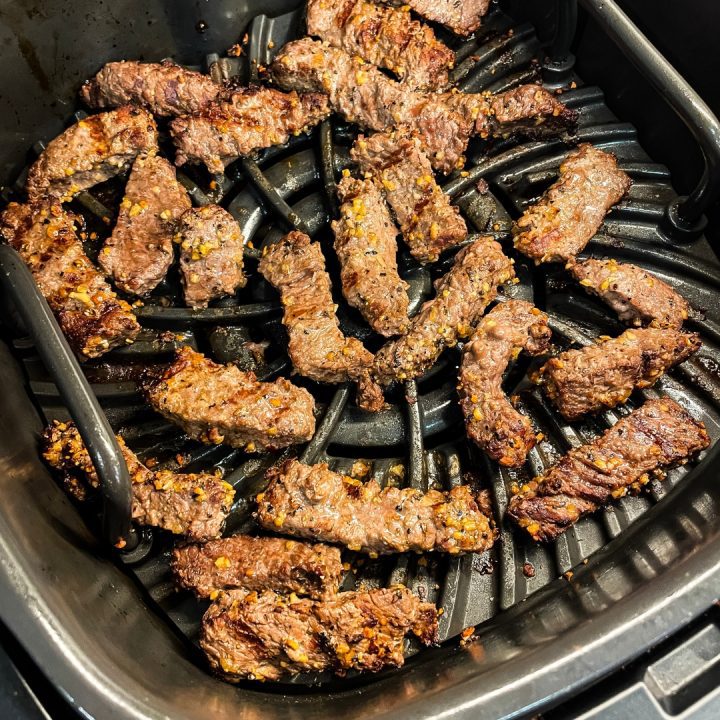 Remove from the air fryer after cooking 5-7 minutes. While the steak is frying, mince garlic and melt butter to make garlic butter for dipping the steak fingers in.