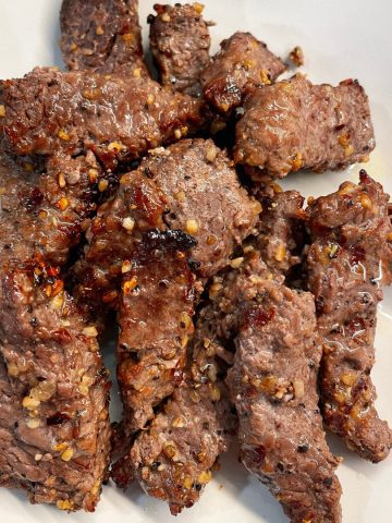 Air fryer cube steak fingers are a naked steak finger made with a simple marinade of avocado oil and Worcestershire sauce and then seasoned with steak seasoning and then air fried.