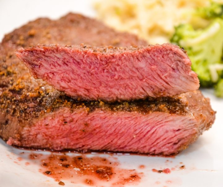 Air fryer steak is easily made with a simple steak seasoning and 8 minutes in the air fryer gets you a perfectly cooked medium rare steak with a top off of some butter for an easy way to have steak on a weeknight.