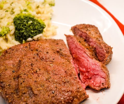 Air fryer steak is easily made with a simple steak seasoning and 8 minutes in the air fryer gets you a perfectly cooked medium rare steak with a top off of some butter for an easy way to have steak on a weeknight.