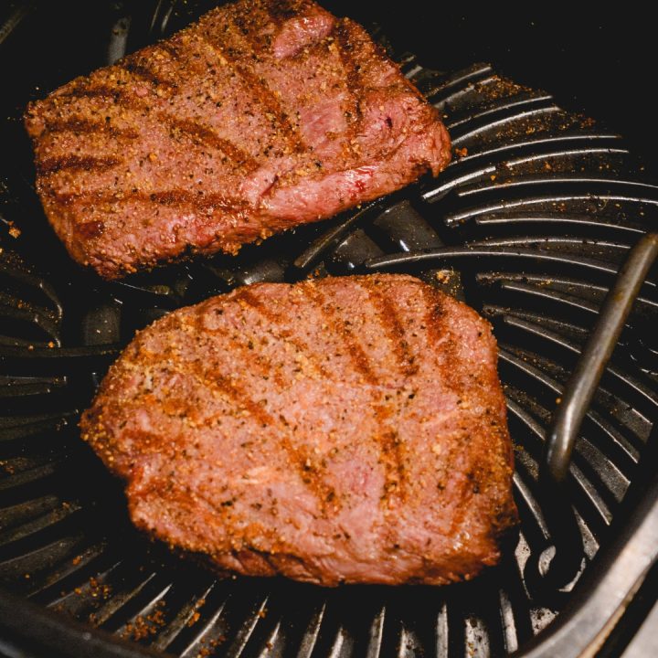 Cook the flat iron steaks in the air fryer for 4 minutes and then flip over and cook another 3-4 minutes.