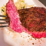 Air fryer steak is easily made with a simple steak seasoning and 8 minutes in the air fryer gets you a perfectly cooked medium rare steak with a top off of some butter for an easy way to have steak on a weeknight.