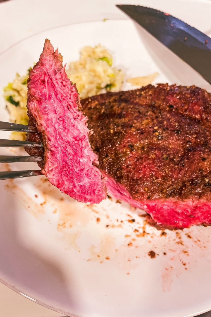 Air fryer steak is easily made with a simple steak seasoning and 8 minutes in the air fryer gets you a perfectly cooked medium rare steak with a top off of some butter for an easy way to have steak on a weeknight.