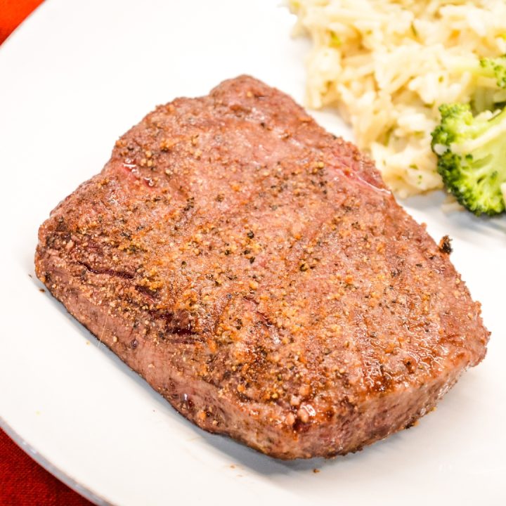 Top the steaks with butter before removing them from the air fryer. Then let the steak rest for 3-5 minutes before cutting into them.