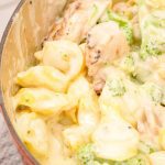 Slice cooked chicken and add to the alfredo sauce, tortellini and chicken. Stir the chicken into the alfredo sauce. Keep a very low heat on to melt the cheese.