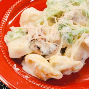 Chicken tortellini alfredo with broccoli is cheese-filled pasta mixed with grilled chicken and broccoli and then smothered with a creamy alfredo sauce.