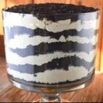 Oreo Dirt Pudding Trifle is an all-time favorite of adults and kids alike with layers of crushed Oreo cookies sandwiched between a decadent cream cheese pudding layer. The result is a match made in heaven.