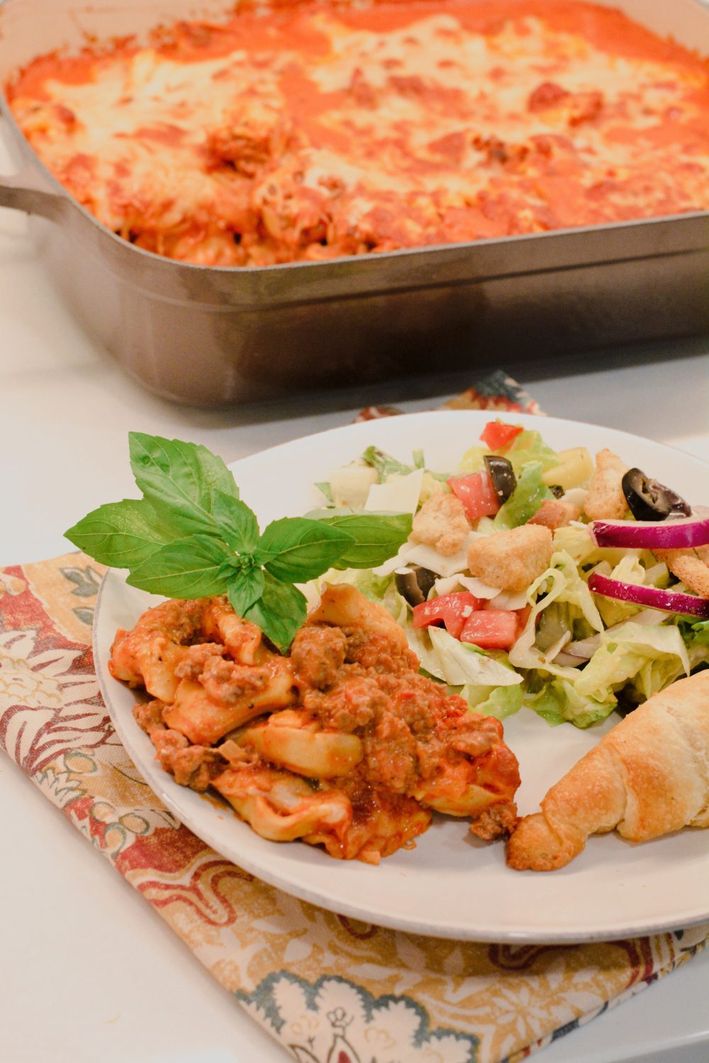 This pasta casserole recipe is a red meat sauce with cheese filled tortellini casserole topped with cheese and make the best baked tortellini.
