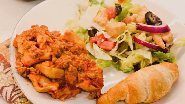 This pasta casserole is a red meat sauce base with cheese filled tortellini.