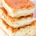 Snickerdoodle cookies and cheesecake combine for these snickerdoodle cheesecake bars made with a double crust of crescent rolls for yummy cinnamon cream cheese bars.