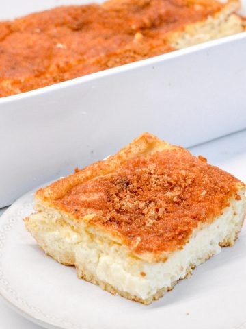 Let the snickerdoodle cheesecake bars with crescent roll crust and cinnamon sugar topping cool for 15 minutes before cutting.