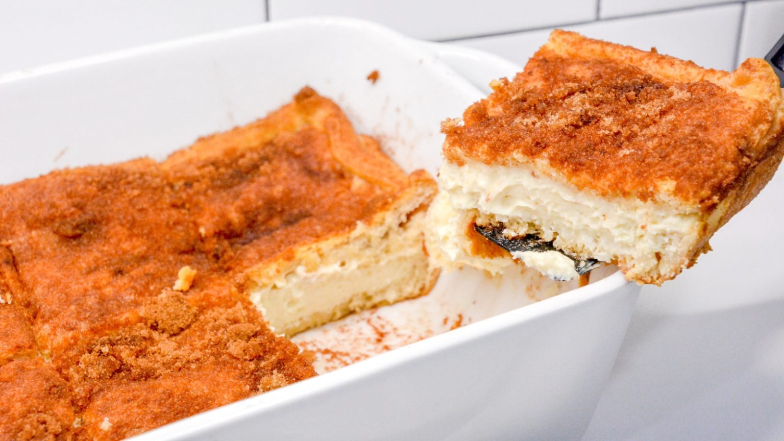 Let the snickerdoodle cheesecake bars with crescent roll crust and cinnamon sugar topping cool