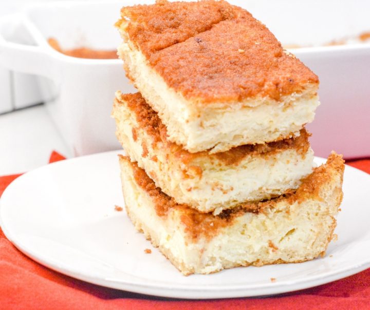 Snickerdoodle cookies and cheesecake combine for these snickerdoodle cheesecake bars made with a double crust of crescent rolls for yummy cinnamon cream cheese bars.