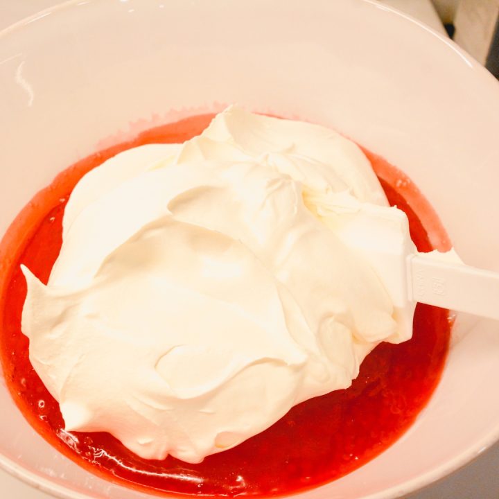 After the strawberry tapioca jello has cooled for a few hours, stir in the cool whip. 