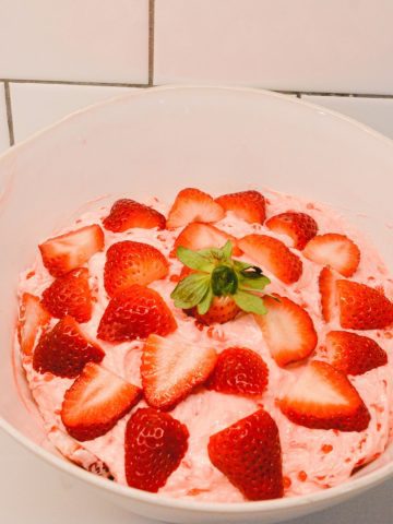 Making this old-fashioned strawberry tapioca salad will create the best pink fluff salad with small pearl tapioca, strawberry jello, and cool whip.