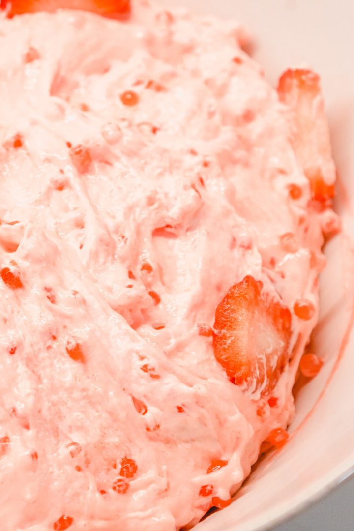 Making this old-fashioned strawberry tapioca salad will create the best pink fluff salad with small pearl tapioca, strawberry jello, and cool whip.