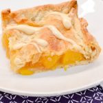 Bourbon peach slab pie is a peach pie bars recipe that is just like a slice of peach pie that is even better topped with brown sugar glaze.