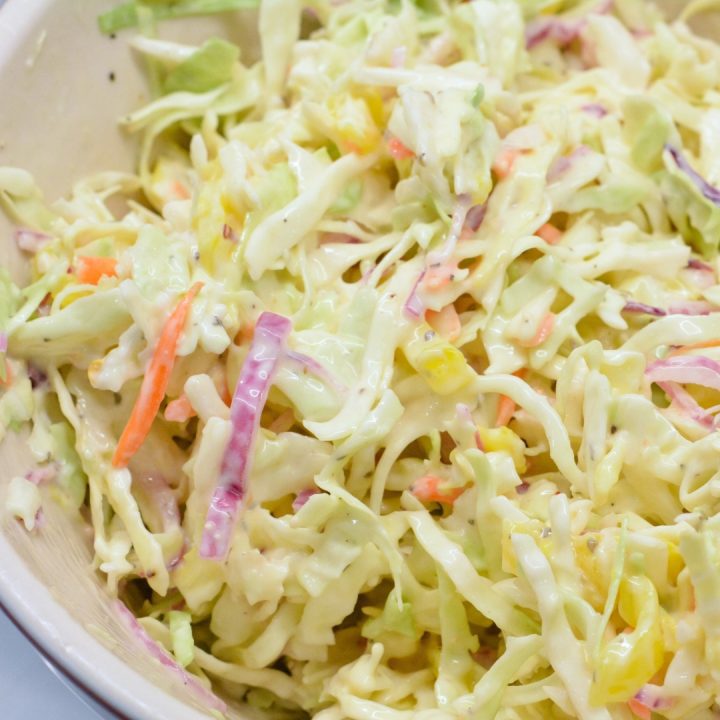 Stir coleslaw to combine all the ingredients. Be sure to dig deep in the bowl to get the cabbage completely coated.