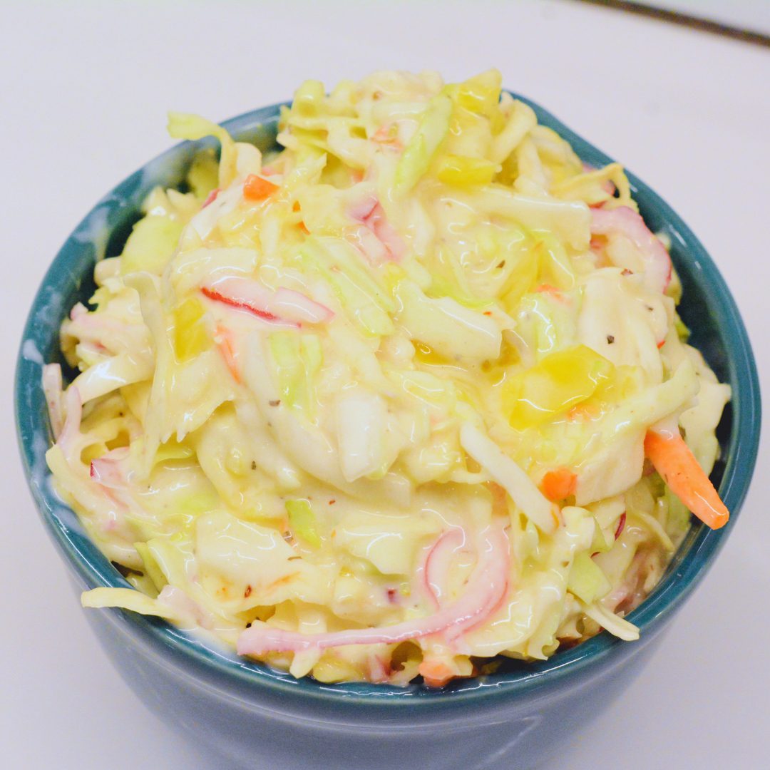 Stir coleslaw to combine all the ingredients. Be sure to dig deep in