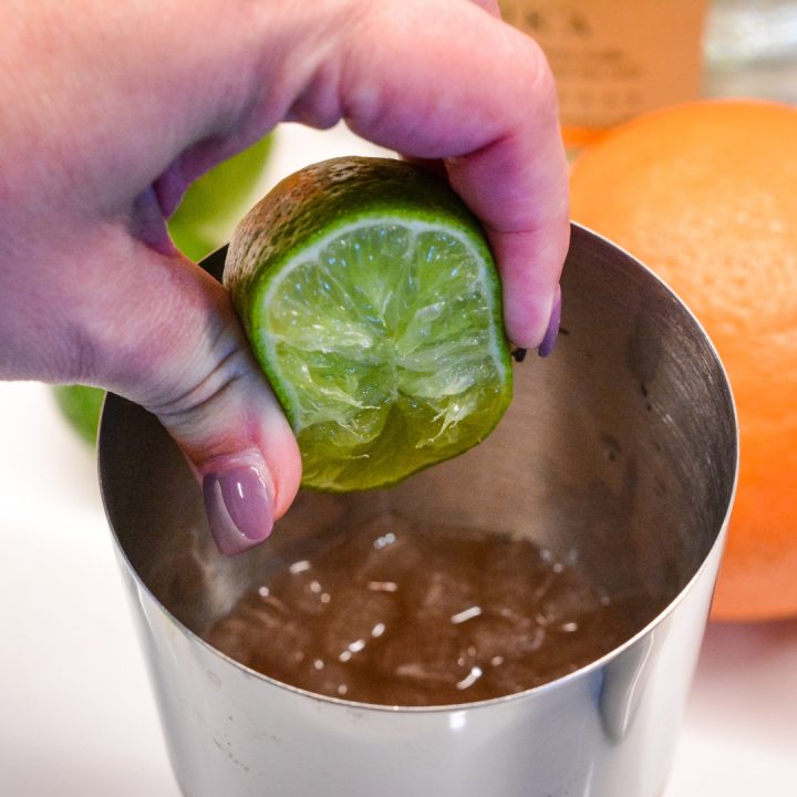 Squeeze fresh lime juice into the shaker before putting the lid on.