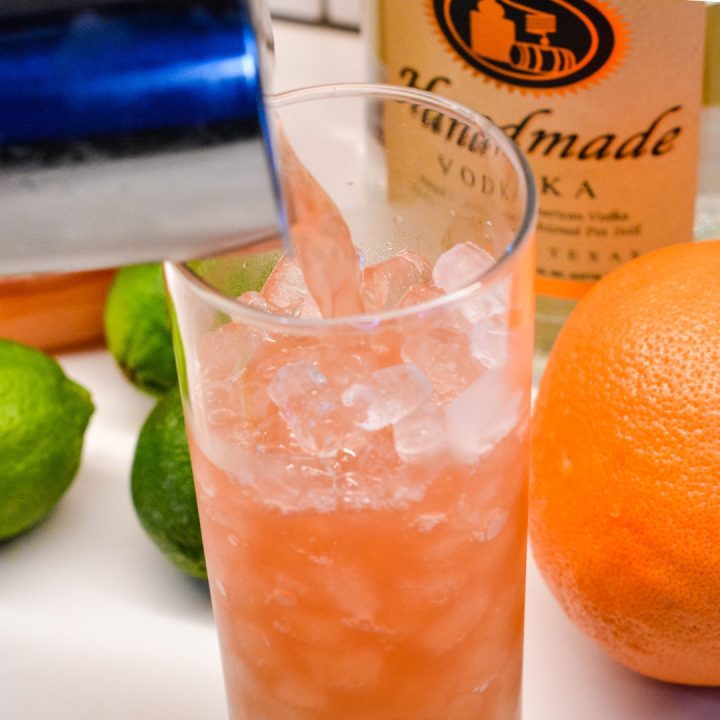 Prep a highball glass with ice and then pour your sea breeze ingredients.