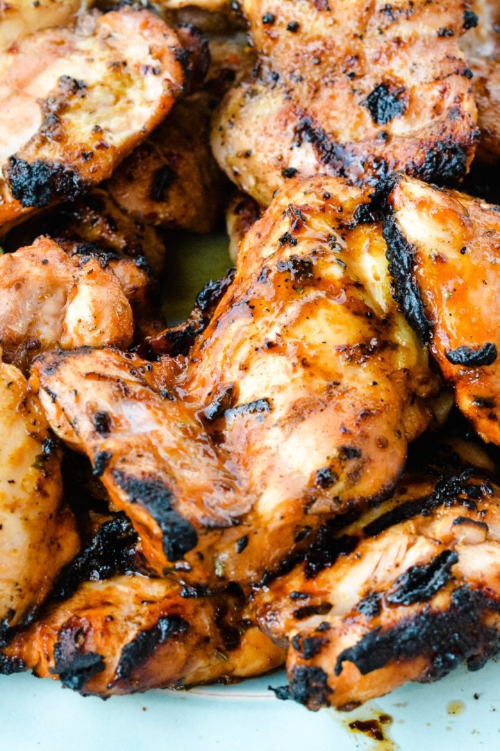 Grilled Buffalo Chicken is made by marinading chicken in a hot sauce, barbecue sauce, and ranch dressing before grilling. 