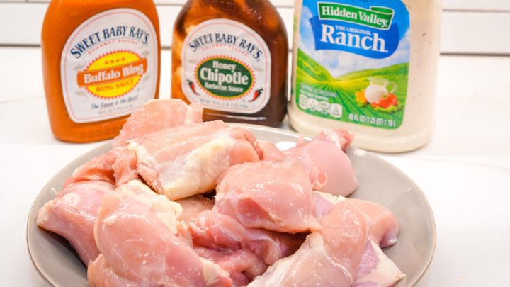 Grilled Buffalo Chicken is made by marinading chicken in a hot sauce, barbecue sauce, and ranch dressing before grilling.