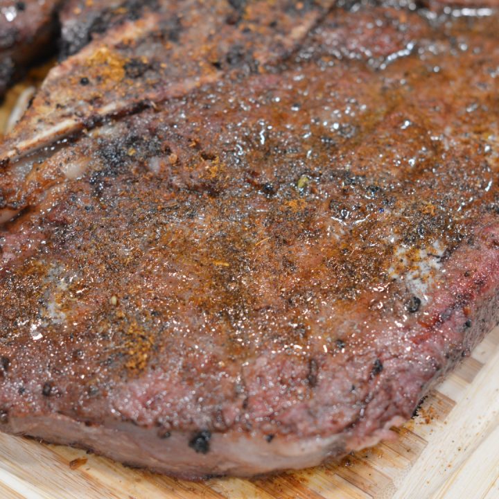 When the steaks are cooked, lay them on the cutting board prepped with the butter and seasoning. Slice and toss in the butter and seasoning. 