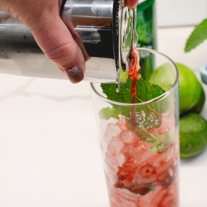 Fill a highball glass with ice and pour the cocktail through a cocktail strainer.
