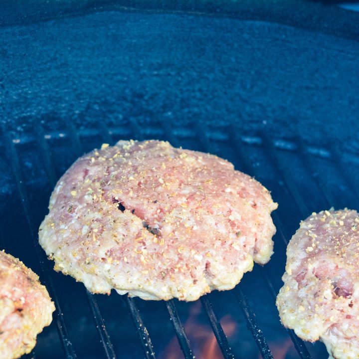 Seal the edges and season with jalapeno popper seasoning. Place the pork burgers onto grill at 350 fahrenheit, not in completely direct heat.
