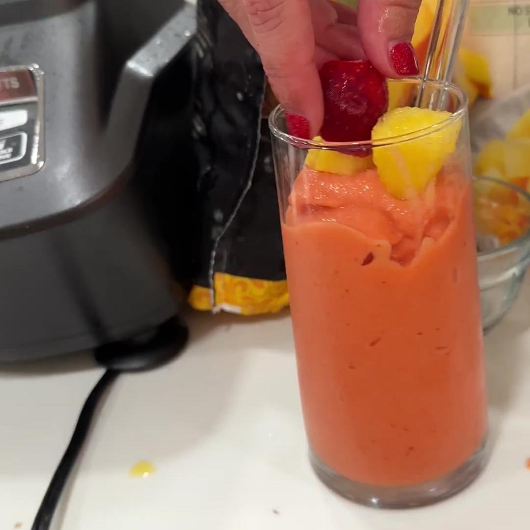 Pour the sunrise sunset smoothie into a cup and use a large smoothie straw. Stir in extra juices for the thinness you desire. Garnish with extra frozen fruit pieces.