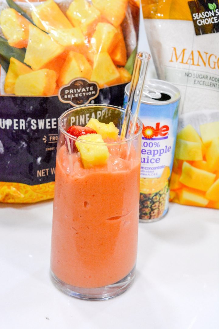 A combination of frozen strawberries, frozen pineapple, and frozen mango with orange and pineapple juice makes the best Tropical Smoothie Cafe Sunrise Sunset smoothie.