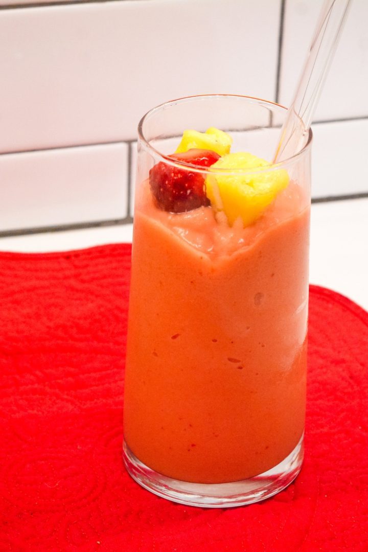 A combination of frozen strawberries, frozen pineapple, and frozen mango with orange and pineapple juice makes the best Tropical Smoothie Cafe Sunrise Sunset smoothie.