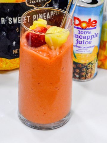 A combination of frozen strawberries, frozen pineapple, and frozen mango with orange and pineapple juice makes the best Tropical Smoothie Cafe Sunrise Sunset smoothie.