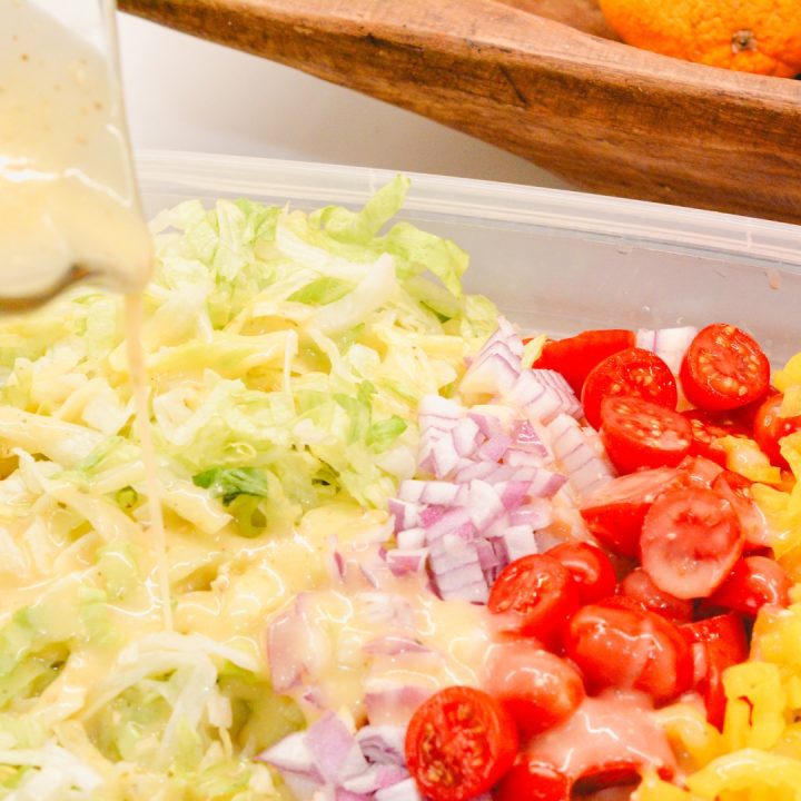 Pour the Italian dressing over the pasta and veggies. Then toss the dressing on the pasta salad.