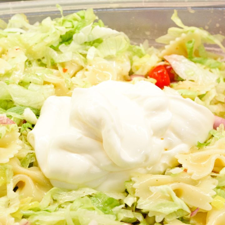 Finally, add mayo into the bowl. Stir to combine the entire salad. Give the Italian pasta salad a taste and season with salt and pepper if needed.