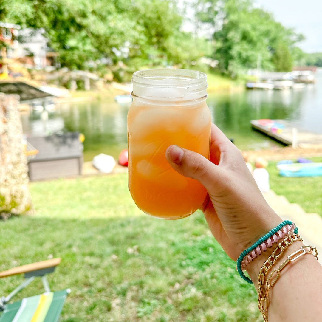 When the pink Country Time lemonade is mixed with the yellow of the pineapple juice, a fun orange punch is created with this pineapple lemonade punch that is slightly tart, and slightly sweet with a little fizz from ginger ale.