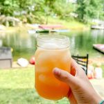 When the pink Country Time lemonade is mixed with the yellow of the pineapple juice, a fun orange punch is created with this pineapple lemonade punch that is slightly tart, and slightly sweet with a little fizz from ginger ale.