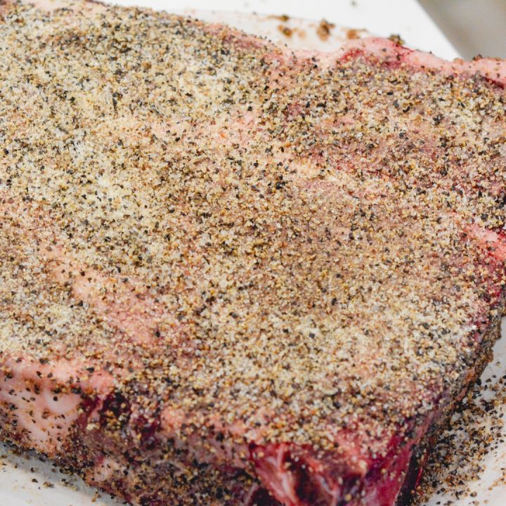 Coat the roasts in the beef rub mixture made from garlic, salt, and pepper.