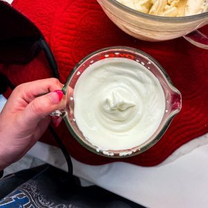 Whip the heavy cream until peaks form. Gently fold in the whipped cream or whipped topping into the cream cheese mixture. This addition brings an airy, dreamlike texture to the dip, mimicking the lightness of cheesecake filling.