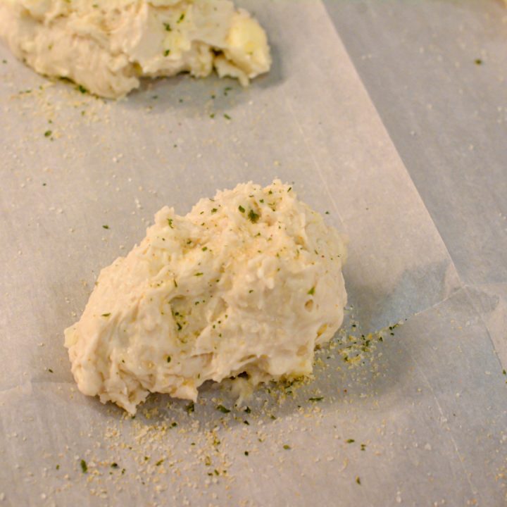 Cut the butter chunks into the bisquick. Then add the blue cheese and buttermilk. Stir to just combine. The dough will be sticky but not runny.