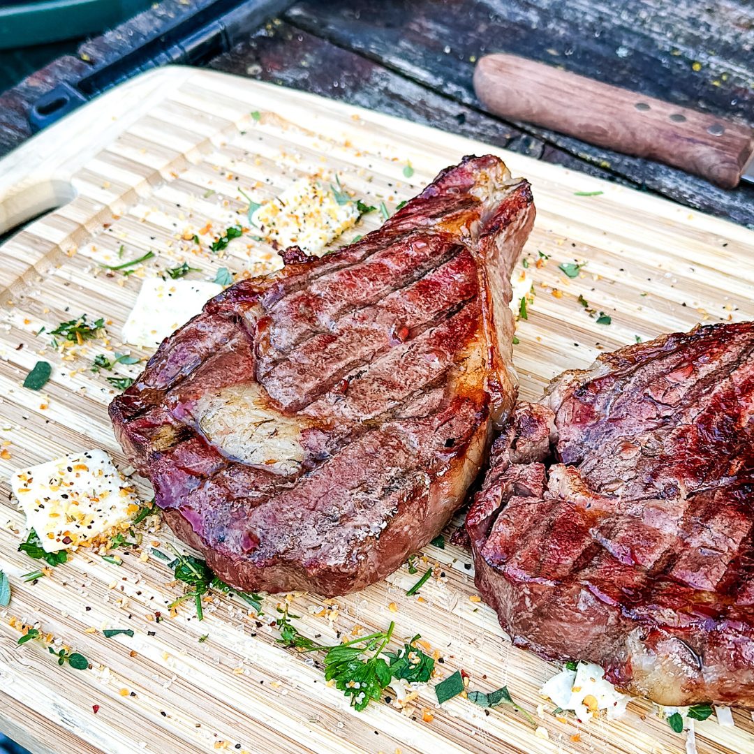 Remove the steaks from the grill and let them rest for about 5 minutes on a cutting board. This allows the juices to be redistributed and ensures a juicy, tender steak.