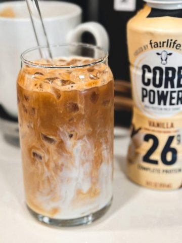 Carefully pour the protein-infused Fairlife Vanilla Power Core milk over the coffee. The milk will naturally blend with the coffee, creating a beautiful marbled effect.