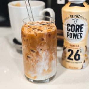 Carefully pour the protein-infused Fairlife Vanilla Power Core milk over the coffee. The milk will naturally blend with the coffee, creating a beautiful marbled effect.