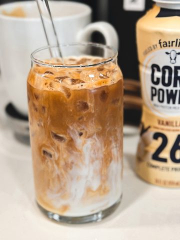 Carefully pour the protein-infused Fairlife Vanilla Power Core milk over the coffee. The milk will naturally blend with the coffee, creating a beautiful marbled effect.