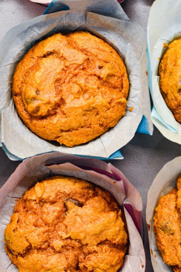 Pumpkin chocolate chip muffins made with a spice cake mix are easy to make with just four ingredients for a quick and easy fall treat.