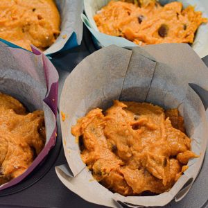 Divide batter evenly into prepared muffin cups, filling each about ¾ full.